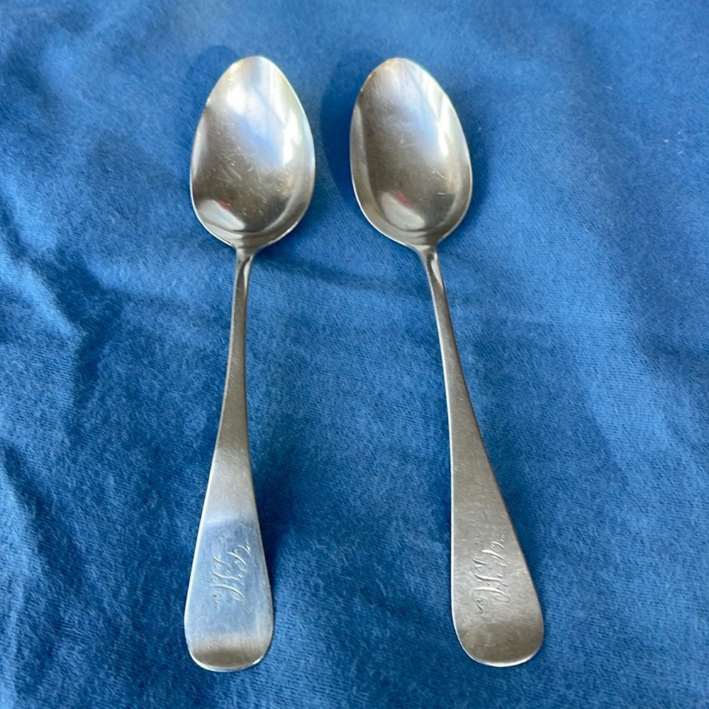 Set of 2 antique spoons , stamped lion and sterling